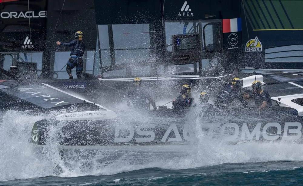 Team France is driven by Quentin Delapierre amid a spray of water.